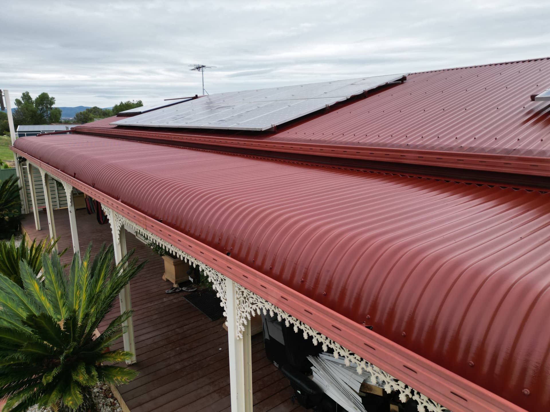 Colorbond metal roof restored with an even airless-sprayed finish
