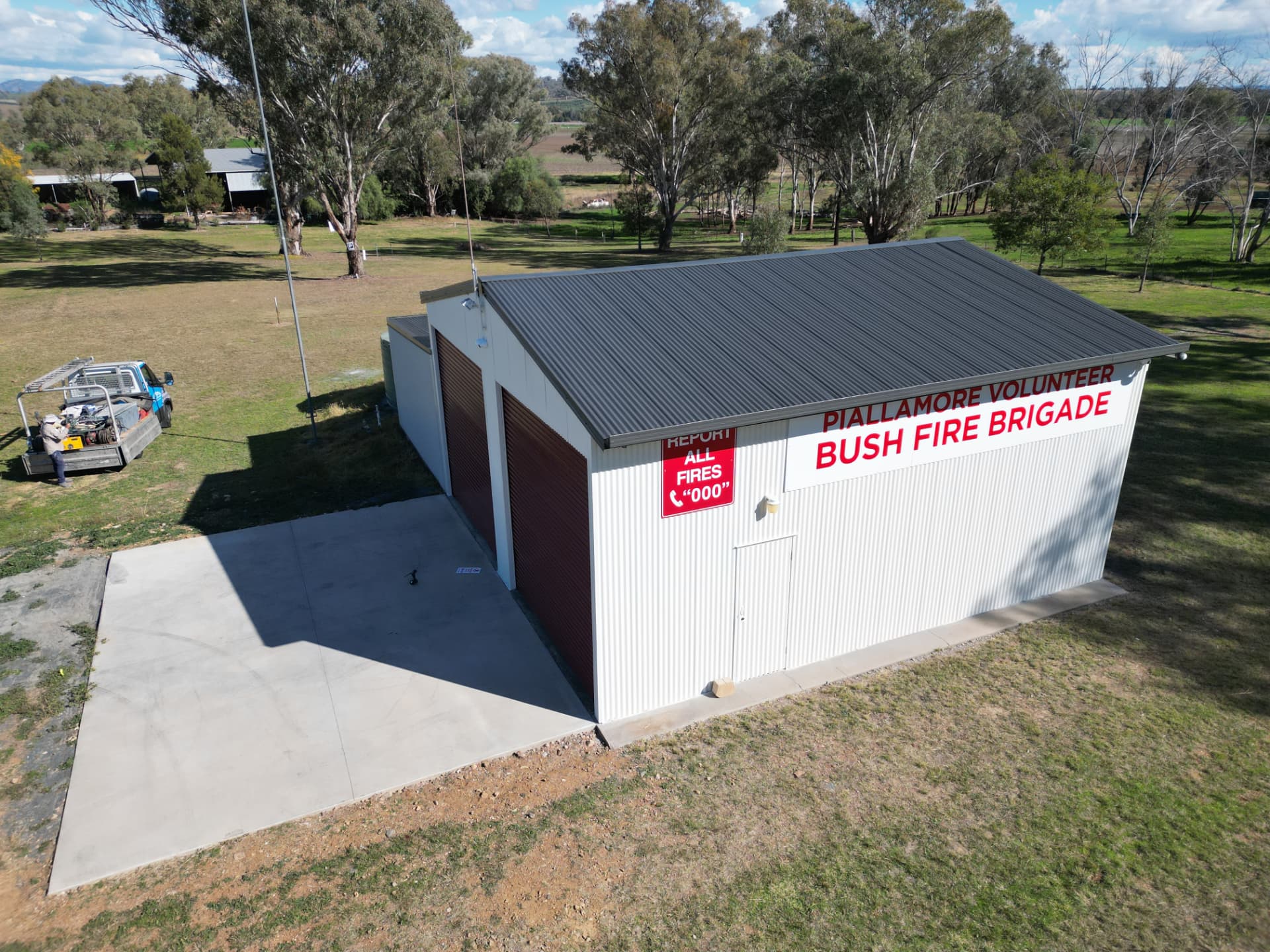 Large shed roof finished with airless spray painting, photographed from the air